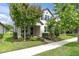 Charming two-story home with beautifully landscaped front yard and inviting entrance at 3757 Villamore Ln, Odessa, FL 33556