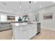 Open-concept kitchen with a large island seamlessly flowing into the living area at 3757 Villamore Ln, Odessa, FL 33556