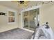Covered patio with ceiling fan, brick floor, string lights, and view of the living room at 3757 Villamore Ln, Odessa, FL 33556