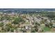 Aerial view of the neighborhood showcasing the area, homes, and nearby lake at 39055 9Th Ave, Zephyrhills, FL 33542