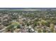 Residential area featuring single-Gathering homes, many trees, and a pond at 39055 9Th Ave, Zephyrhills, FL 33542