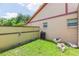 A cozy backyard featuring a small grass area and some decorative rocks at 39055 9Th Ave, Zephyrhills, FL 33542