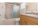 Bright bathroom with tiled shower, and vanity with granite countertop at 39055 9Th Ave, Zephyrhills, FL 33542