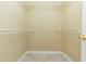 Walk-in closet includes tile floor, white wire shelving, and base trim at 39055 9Th Ave, Zephyrhills, FL 33542