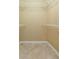 Walk-in closet includes tile floor, white wire shelving, and base trim at 39055 9Th Ave, Zephyrhills, FL 33542