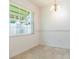 Bright dining area featuring a window offering natural light and elegant chandelier at 39055 9Th Ave, Zephyrhills, FL 33542