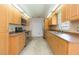 Kitchen with wood cabinets, tile backsplash, stainless steel appliances, and breakfast nook at 39055 9Th Ave, Zephyrhills, FL 33542