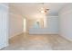 Bright living area with neutral paint, vaulted ceiling, tile floors and open to other living areas at 39055 9Th Ave, Zephyrhills, FL 33542