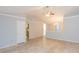Spacious living room features vaulted ceilings, neutral colors, tile flooring, and lots of natural light at 39055 9Th Ave, Zephyrhills, FL 33542