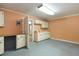 Room with overhead lighting, cabinets, countertops, neutral walls, and doorway to another room at 39055 9Th Ave, Zephyrhills, FL 33542