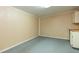 Bright room with overhead lighting, neutral walls, cabinets, and countertops at 39055 9Th Ave, Zephyrhills, FL 33542