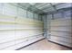 This shed boasts an organized interior with shelving to maximize space at 39055 9Th Ave, Zephyrhills, FL 33542