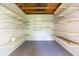 An interior view of the shed featuring shelving units for storage at 39055 9Th Ave, Zephyrhills, FL 33542