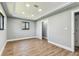 Bedroom featuring recessed lighting, wood floors, and natural light from window at 400 83Rd Ne Ave, St Petersburg, FL 33702