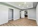 Bedroom featuring wood floors and recessed lighting, with a view to bathroom at 400 83Rd Ne Ave, St Petersburg, FL 33702