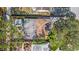 An aerial view showcases the home, a pool, a well-maintained roof and an adjacent yard at 4642 29Th N Ave, St Petersburg, FL 33713