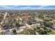A scenic aerial view of a neighborhood with mature trees and a clear view of the city skyline in the distance at 4642 29Th N Ave, St Petersburg, FL 33713