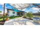 Back patio featuring an artificial lawn, shade sails, garden and a comfortable seating area at 4642 29Th N Ave, St Petersburg, FL 33713