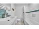 Modern bathroom with decorative tile accents, bathtub and shower, and recessed shower niche at 4642 29Th N Ave, St Petersburg, FL 33713