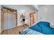 Inviting bedroom featuring a work space, blue bedspread, and access to an adjacent room, ideal for work and relaxation at 4642 29Th N Ave, St Petersburg, FL 33713