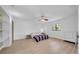 Bright bedroom featuring hardwood floors, a ceiling fan, and a large window, providing a comfortable and airy retreat at 4642 29Th N Ave, St Petersburg, FL 33713