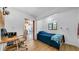 Comfortable bedroom with desk, blue bedspread, and natural light from the window, perfect for relaxation and productivity at 4642 29Th N Ave, St Petersburg, FL 33713