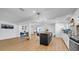 Contemporary open-concept kitchen and living area with sleek cabinetry and stainless steel appliances at 4642 29Th N Ave, St Petersburg, FL 33713