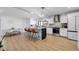 Modern kitchen with marble island, stainless steel appliances, and stylish pendant lighting at 4642 29Th N Ave, St Petersburg, FL 33713