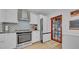 Updated kitchen with stainless steel appliances, white cabinets, and trendy backsplash for a modern feel at 4642 29Th N Ave, St Petersburg, FL 33713