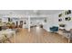 Spacious living room showcasing an open layout with hardwood floors, connecting kitchen, dining, and entryway with an airy feel at 4642 29Th N Ave, St Petersburg, FL 33713