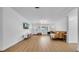 Spacious living room with laminate flooring, natural lighting, and a cozy brown leather sofa at 4642 29Th N Ave, St Petersburg, FL 33713