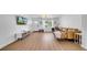 Bright living room with hardwood floors, a large window, and contemporary decor creating an inviting space at 4642 29Th N Ave, St Petersburg, FL 33713