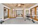 Light-filled sunroom with tiled floors, wooden doors, and a ceiling fan, creating a versatile space for work or relaxation at 4642 29Th N Ave, St Petersburg, FL 33713