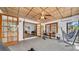 Bright sunroom with tiled floors, wooden doors, ceiling fan and a hammock, perfect for a relaxing retreat at 4642 29Th N Ave, St Petersburg, FL 33713
