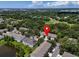 Scenic aerial view showcases the home's location near lush greenery, ponds, and neighborhood amenities at 4732 Ashburn Pond Way, Tampa, FL 33610
