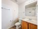 A full bathroom shows vanity, mirror, toilet and shower with curtain rod at 4732 Ashburn Pond Way, Tampa, FL 33610