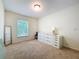 Bedroom with carpet and bright window, neutral colors and decor, creating a comfortable space at 4732 Ashburn Pond Way, Tampa, FL 33610