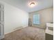 Bedroom with a window for natural light, carpet, and space for comfortable relaxation at 4732 Ashburn Pond Way, Tampa, FL 33610