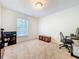 Bedroom with a carpet, window for natural light, and space for relaxation and activities at 4732 Ashburn Pond Way, Tampa, FL 33610
