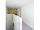 Upstairs hallway leading to bedrooms, featuring a staircase and carpet flooring at 4732 Ashburn Pond Way, Tampa, FL 33610