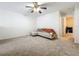 Bright living room featuring neutral colors, carpet, and comfortable sectional sofa creating a relaxing space at 4732 Ashburn Pond Way, Tampa, FL 33610