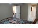 Bedroom featuring a decorative quilt, and access to additional rooms at 4736 Sunny Loop, Holiday, FL 34690