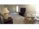 Inviting living room space with a dining table, comfortable seating, and natural light at 4736 Sunny Loop, Holiday, FL 34690