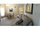 Cozy living room with a comfortable sofa, dining area, and view into the kitchen at 4736 Sunny Loop, Holiday, FL 34690