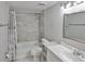 Bathroom with updated fixtures, tiled shower, and vanity, offering a clean and modern aesthetic at 4801 W Mcelroy Ave # D104, Tampa, FL 33611