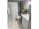 Bathroom featuring updated fixtures, tiled shower, and vanity, creating a clean and refreshed space at 4801 W Mcelroy Ave # D104, Tampa, FL 33611