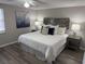 This cozy bedroom is stylishly decorated with a decorative headboard and matching bedside tables at 4801 W Mcelroy Ave # D104, Tampa, FL 33611