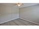 Bright bedroom with laminate flooring and ceiling fan, offering a comfortable and versatile living space at 4801 W Mcelroy Ave # D104, Tampa, FL 33611