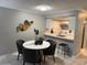 Open-concept dining area seamlessly connects to the kitchen, creating an inviting and functional space at 4801 W Mcelroy Ave # D104, Tampa, FL 33611