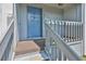 The front door to the residence has a bright blue color with gold hardware at 4801 W Mcelroy Ave # D104, Tampa, FL 33611